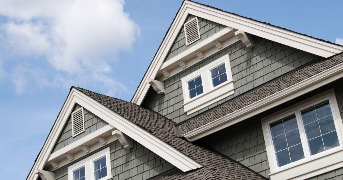 close up of upper windows of a house 